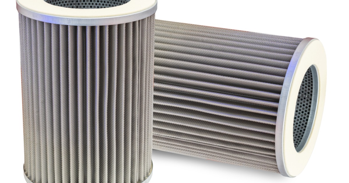 Two large gray pleated cylindrical air filters with metal mesh cores, one upright and one lying on its side.